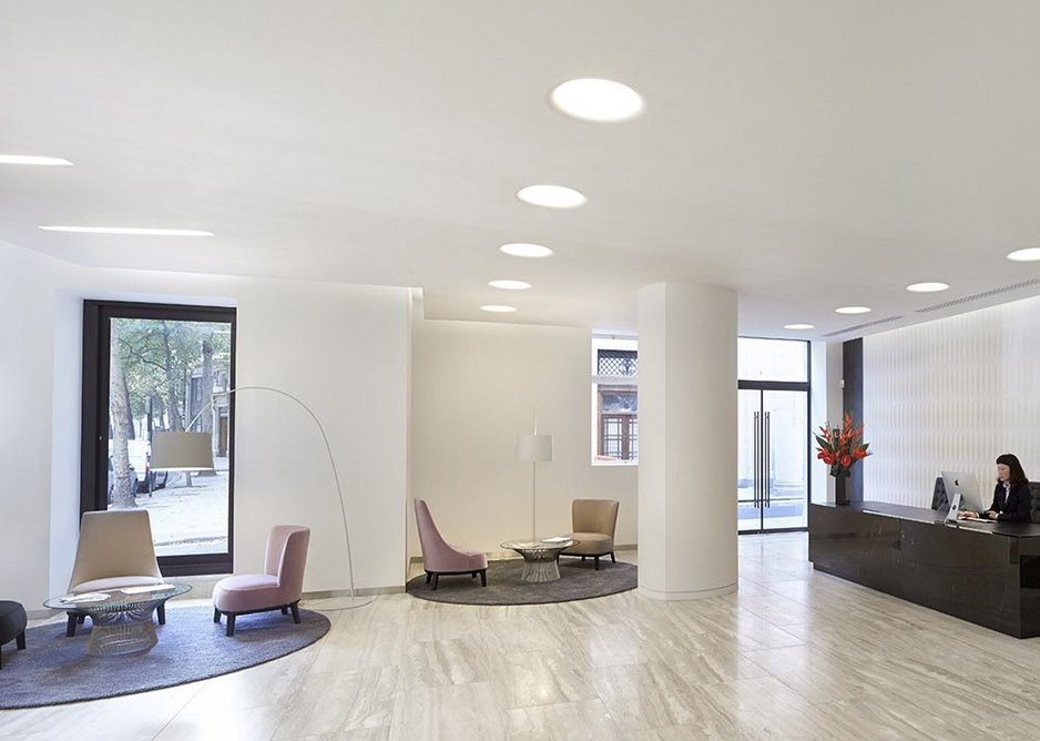 South east wing reception with curved plaster wall.