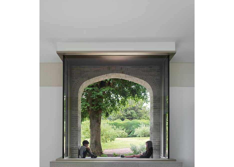 The learning centre’s vitrine window sits under an arch reminiscent of those at the castle.