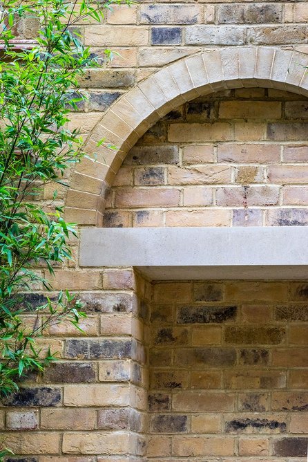 Detail of fountain lintel in garden.