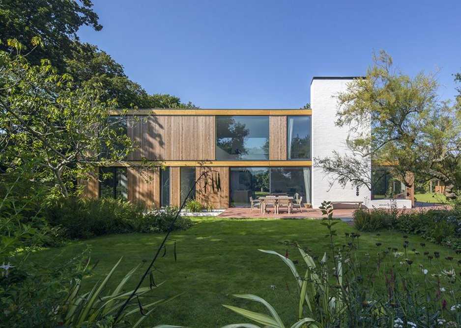 Private category – Woodpeckers house by Strom Architects, New Forest, Hampshire. Timber-framed replacement for a 1930s bungalow. on wooded site.