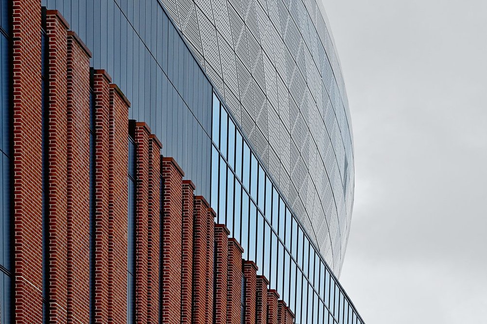 Brickwork and  metal cladding evoke dockland heritage and  allude to the fabric of Goodison Park.
