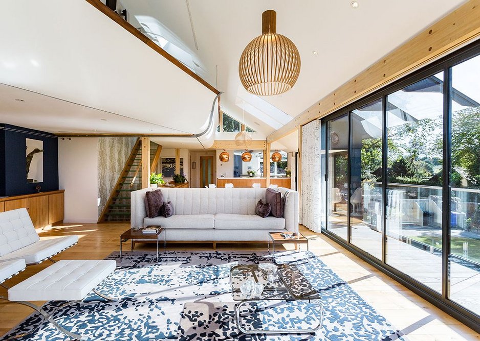 Above the living area is the structural curved-plywood study mezzanine.