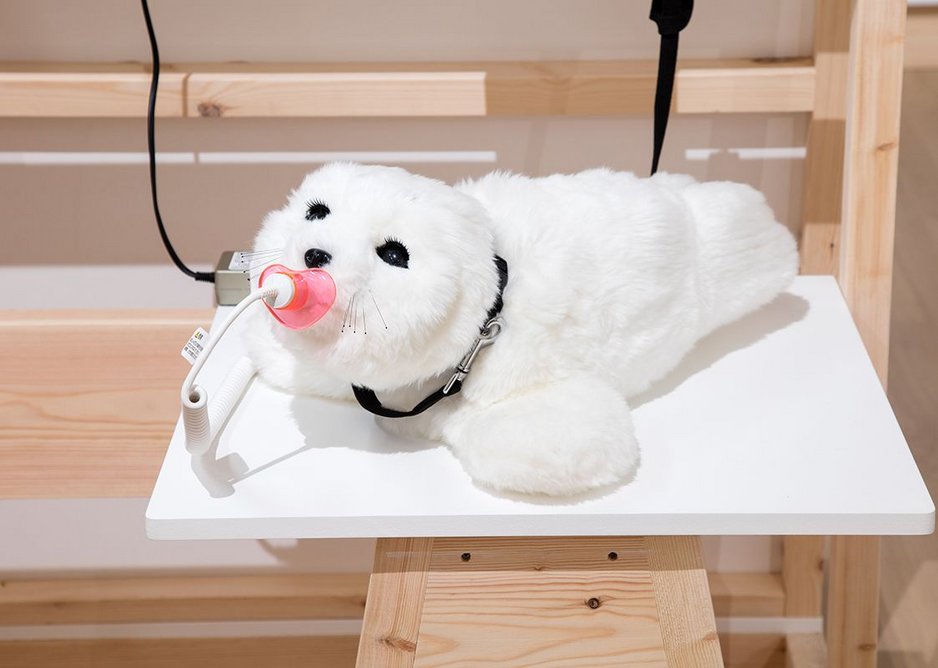 Paro the Seal therapeutic robot, used to improve communication and reduce stress in dementia patients.