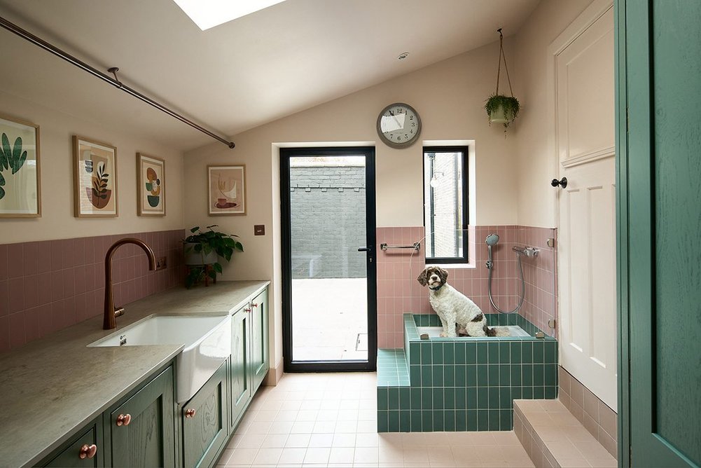 A dedicated utility room allows space for humans as well as the family pet to get cleaned up before entering the house proper.