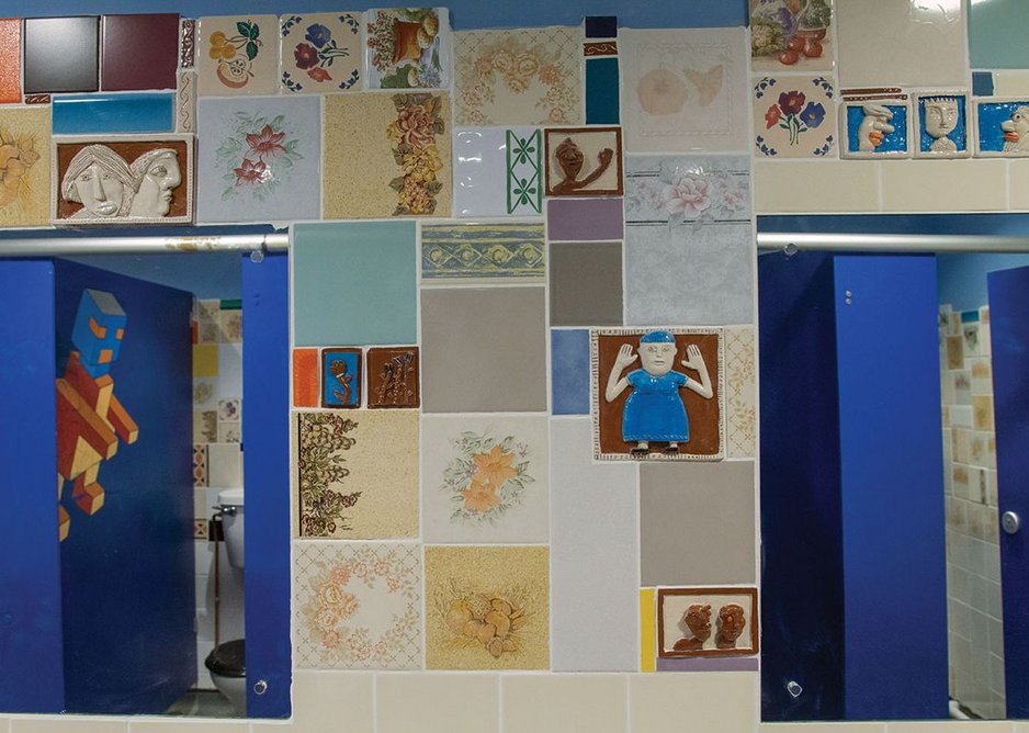 Donated tiles in the washrooms create beauty from contingency.
