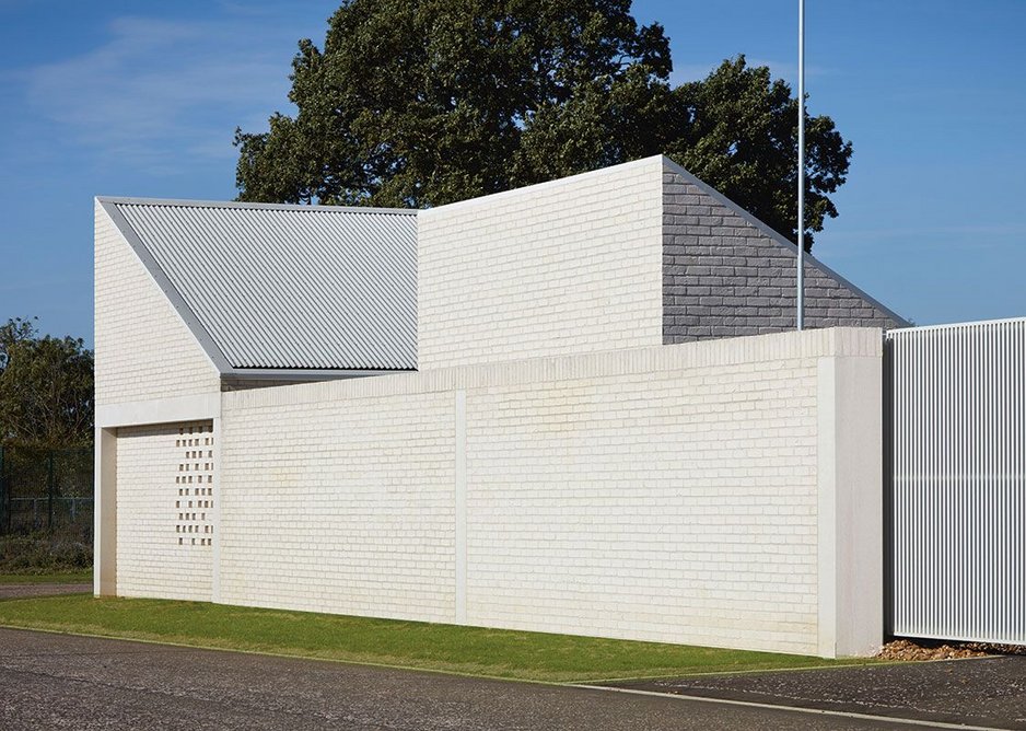 View of the southern utility cluster with its compound wall and gate.