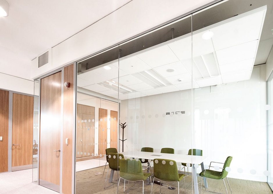 Chicago Metallic Infinity framed ceiling islands, installed with Rockfon Blanka E ceiling tiles, help create a modern design for the  Glucksman Library conference rooms.