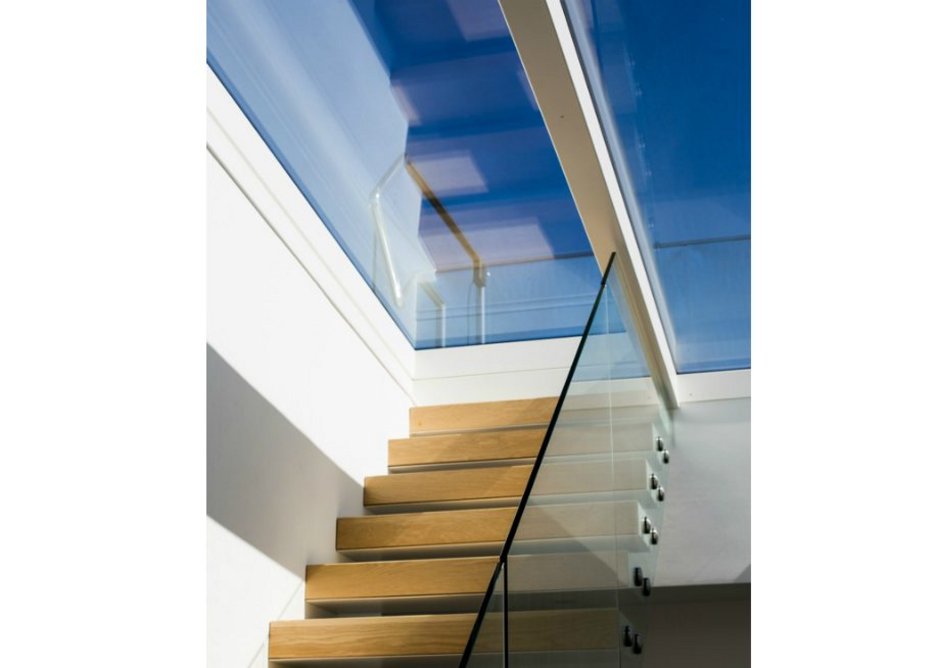 Glazing Vision's Sliding Over Fixed rooflight over the central stairway: A sliding pane retracts over a fixed one to open up access to the roof.