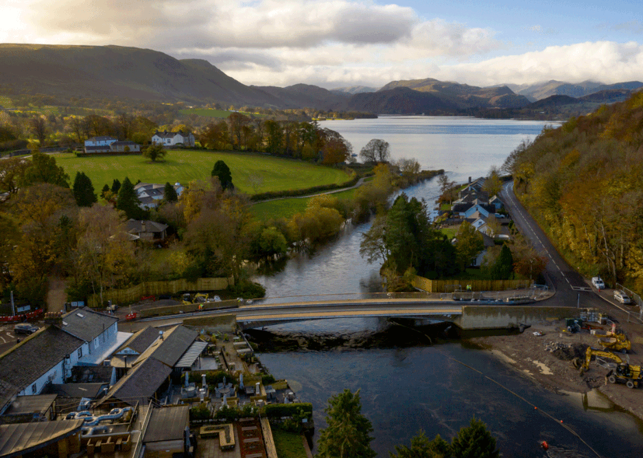 Ullswater and the River Eamont calmly flowing from it through Pooley Bridge.