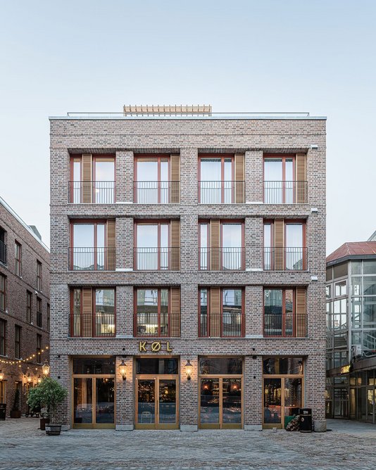 Loggias rather than cantilevered balconies are designed to make the public space below more inviting as a place to linger.