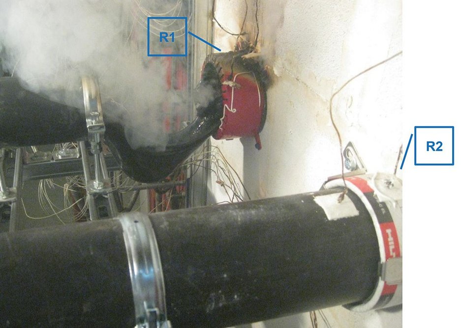 The internal and external firestop collars on pipe R1 fail after 25 mins, resulting in the pipe melting externally.