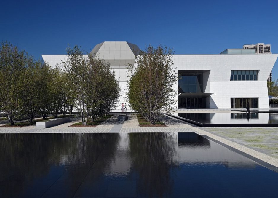 The chiselled white granite-clad form of Maki’s museum with auditorium and dome.