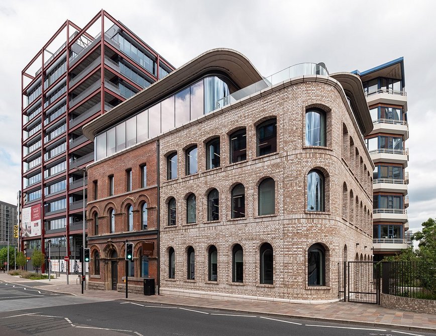 Riverside House is part of a wider development that also incorporates the Two New Bailey structure to the left.