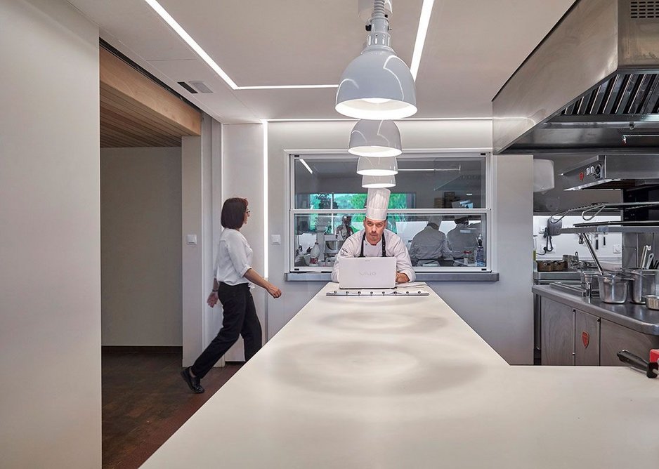 Rooms with a view: windows open up Hotel Casamar's working kitchen to the gaze of the customer.