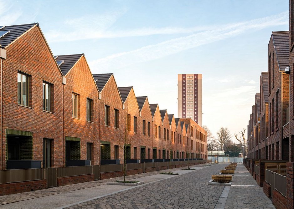 Clever, wide terraces make optimum use of a narrow strip of land next to the Academy; each has a garage with a terrace above it (right).