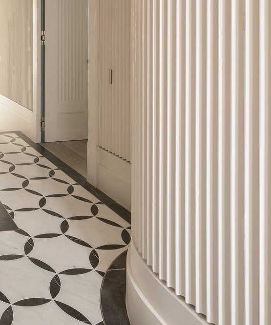 Patterned marble flooring, lacquered doors and cast GRG Alpha Gypsum fibrous plaster fluted wall panels form part of the no-holds-barred spec.