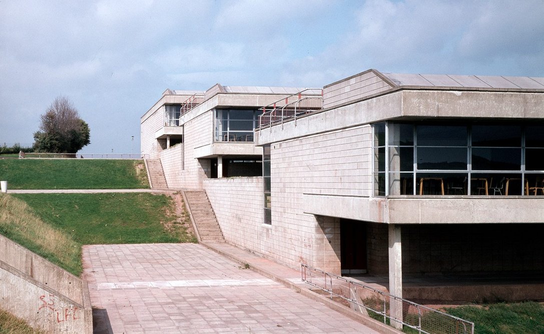 Newport High School, Gwent, was completed in 1972 and configured as a cluster of small south-facing houses stepping down a hill and linked by covered streets.