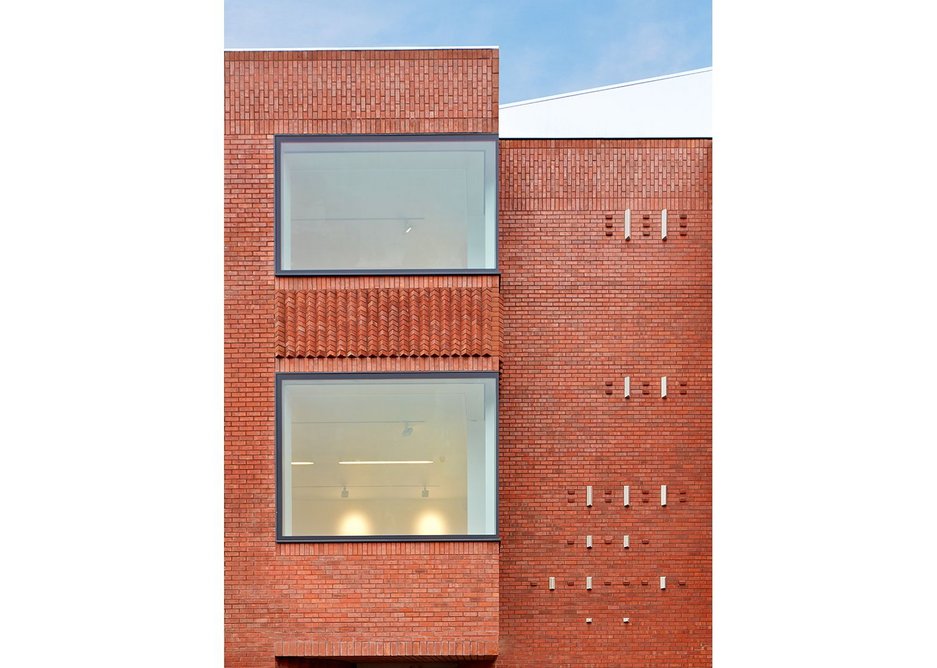 Pleats and cuts of the brickwork on the north facade.