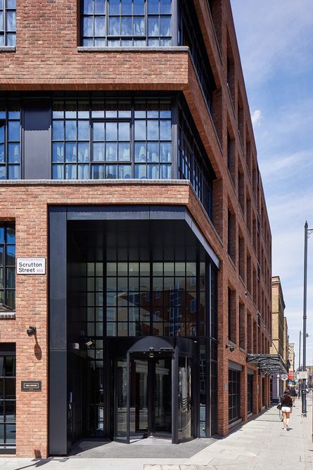Red brick facade with aluminium fenestration from Scrutton Street.