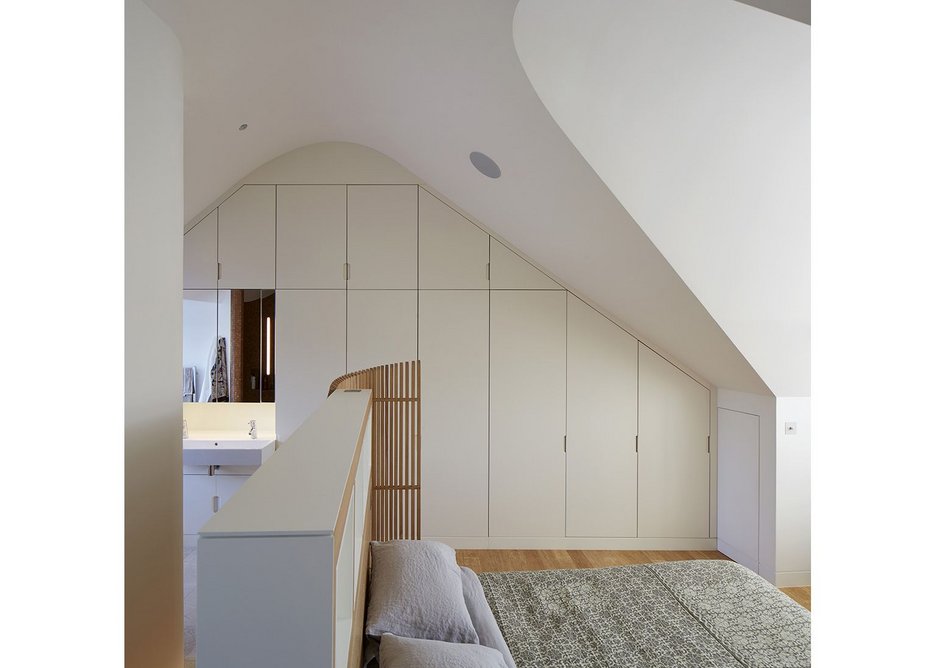 Up top: The commanding position of the main bedroom, the ceiling drawn into curves.