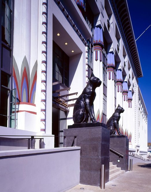 The Carreras cigarette factory, designed by Arthur George Porri in 1928, with two large bronze cats flanking the entrance.