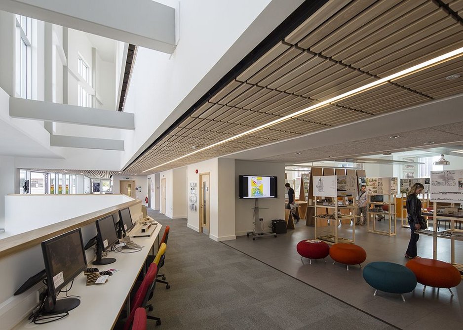 Timber ceilings add a sense of warmth reminscent of school of architecture's previous home