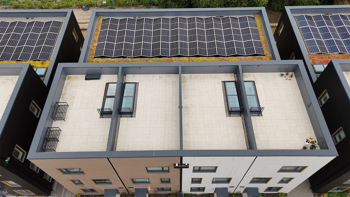 Aero access rooflights and solar panels have been installed on top of buildings.