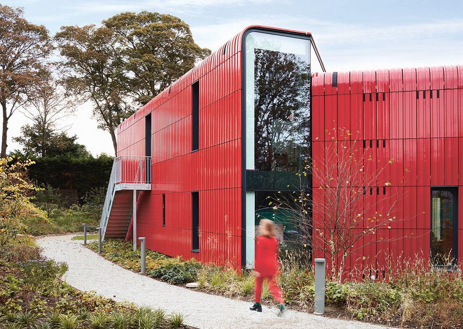 The building’s north face offers more enclosed, views from within its red terracotta cladding.