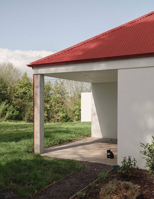 The cruciform plan creates corner porches for boots, equipment and lounging cats.