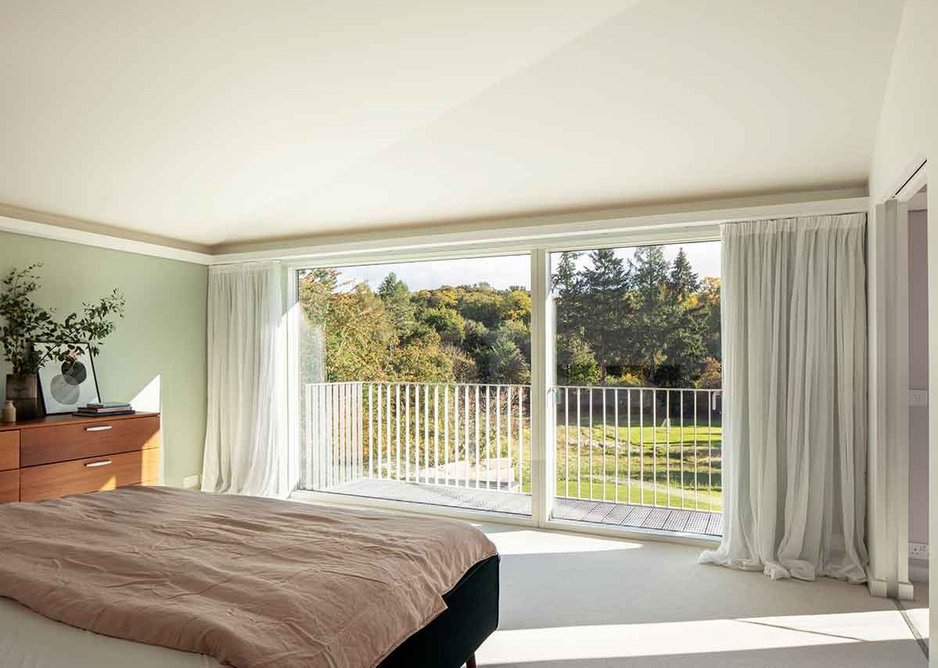 Master bedroom and balcony with views onto the landscape.