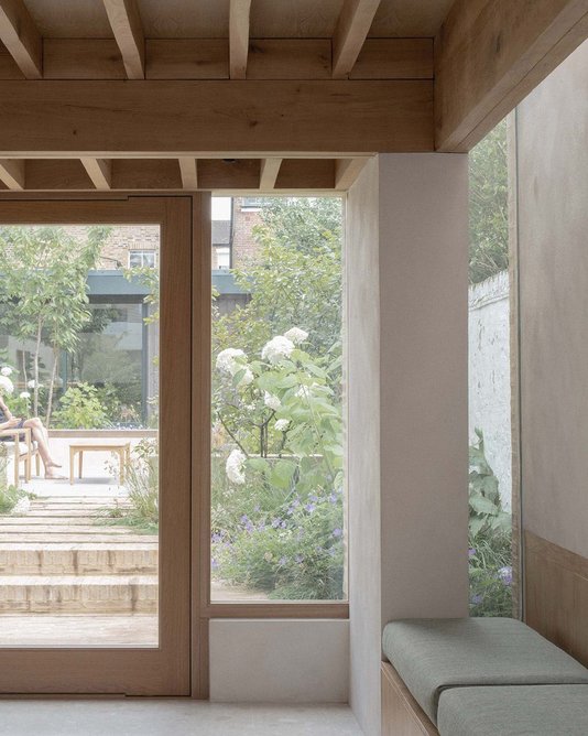 A new patio connects the extension to the garden. Photography: Nick Dearden