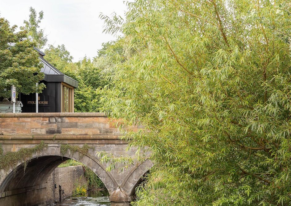 View of Tollhouse from the Water of Leith with its steel cladding to protect against damp deterioration.