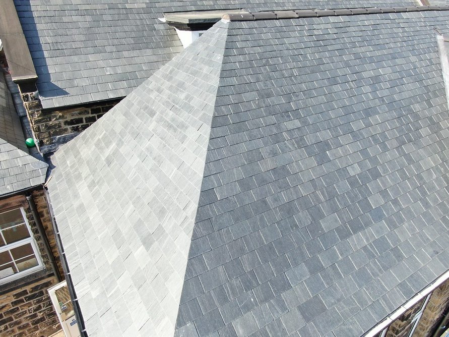 Riverstone phyllite roofing installation at Stannington Infant School, Sheffield: Roofing Cladding & Insulation Magazine's 2022 Pitched Roofing Awards Project Winner.