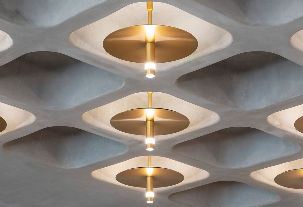 Pritchard Themis’s pendant lights illuminate the concrete coffers in the reception of Buckley Gray Yeoman’s 77 Coleman Street in the City of London.