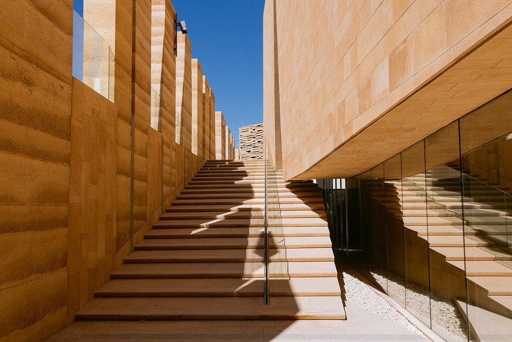 The rammed earth mix for Diriyah Art Futures is intended to evoke the sense of architecture emerging from the natural landscape.
