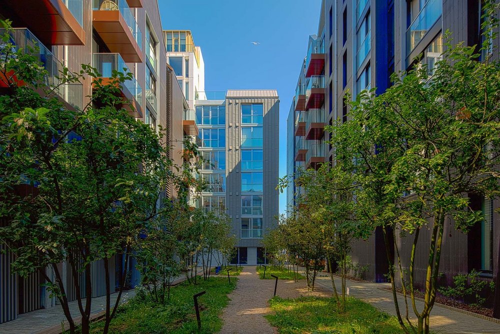 Residential courtyard, with landscape design by J&L Gibbons inspired by Regency planting characteristic of Brighton. The scheme also provides safe walking and cycle routes, and storage for 600 bikes.