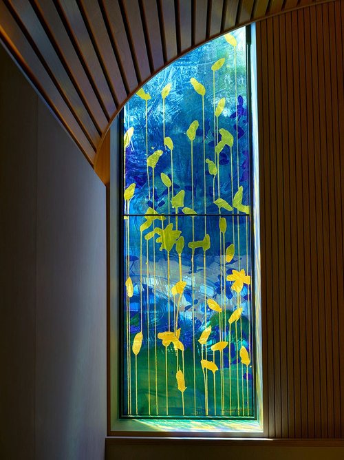 Daffodils are one of the repeat motifs in the stained glass by Brian Clarke Studio at Westminster Coroner’s Court. Photo: Prudence Cuming