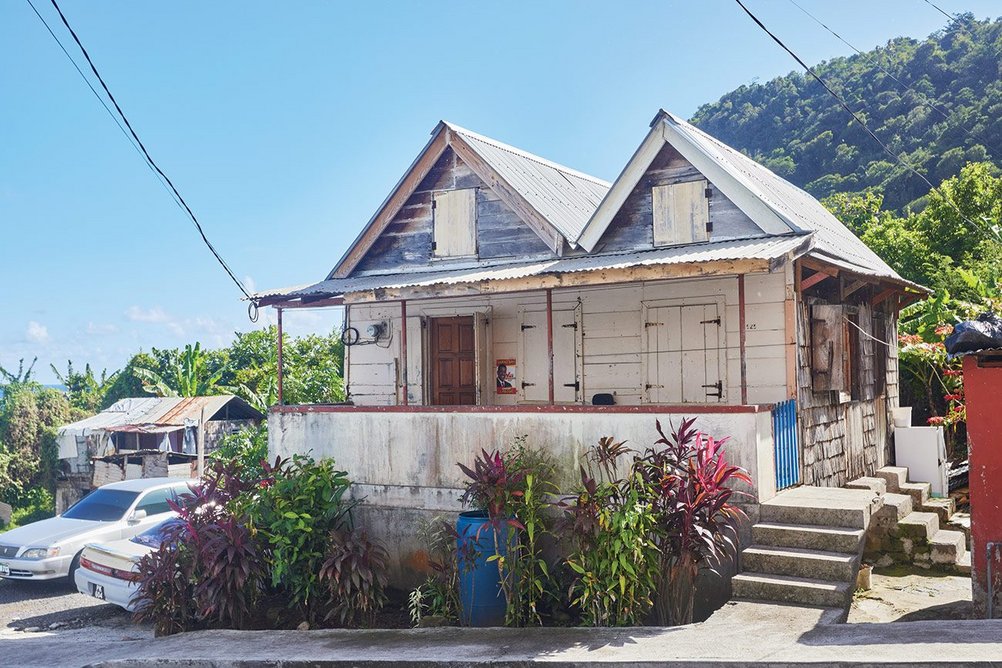 Double gable-roofed ti kai on L’Allay, the main street of Grand Bay, built by the owner’s grandfather. She has made upgrades, but is determined to protect the heritage value of the house.