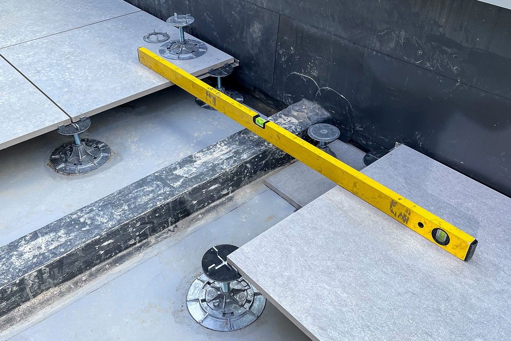 The Buzon class A-rated A-PED has the functionality of regular pedestals, allowing millimetre-precise slope correction to cope with falls on balconies and terraces.
