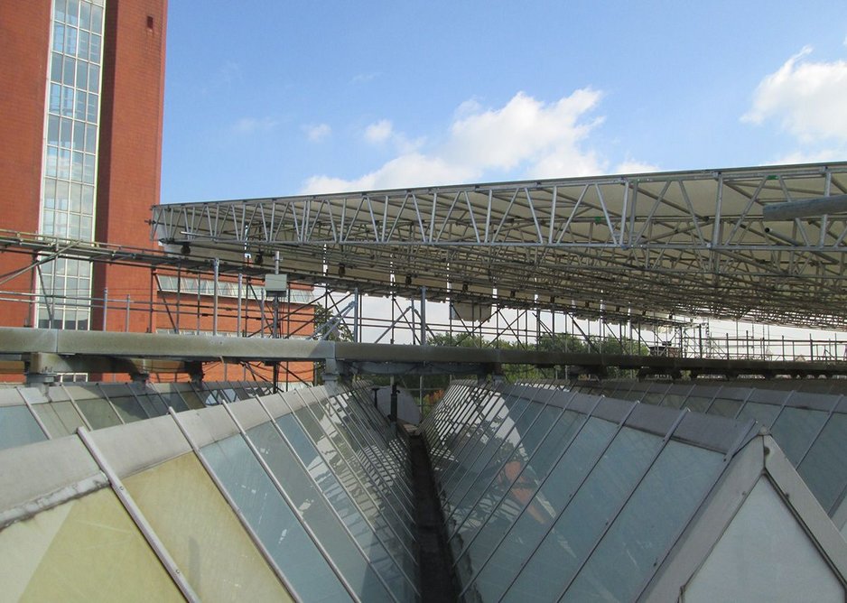 The original glass roof, with its thin aluminium sections, being prepared for the remediation works.