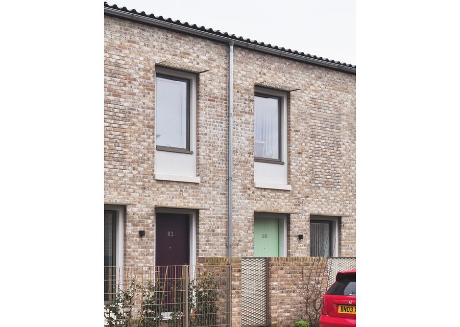 Careful composition of windows and downpipes ensure uncluttered facades.