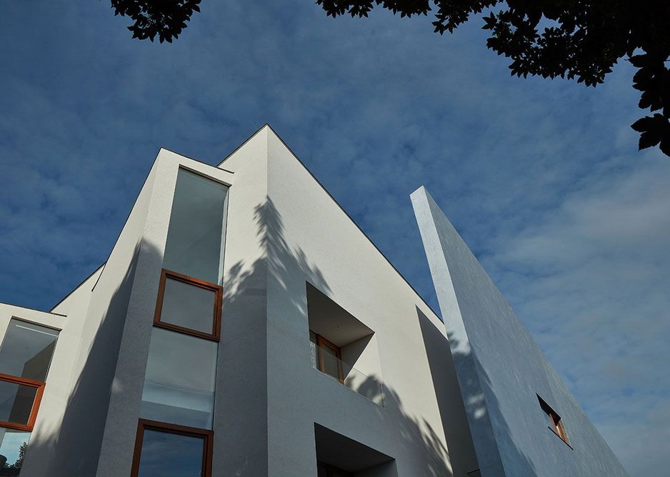 Bedroom windows are angled to look out over the sea. Stealth House, Devon by Guy Greenfield Architects.