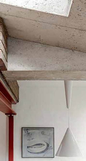 Exposed concrete and steelwork respond to the Brutalism of the 1970s house.