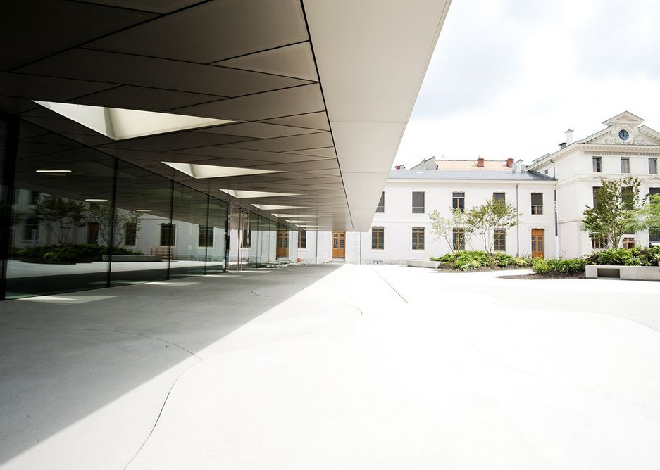 Quite some cantilever as the facade shoots into a canopy onto the square.