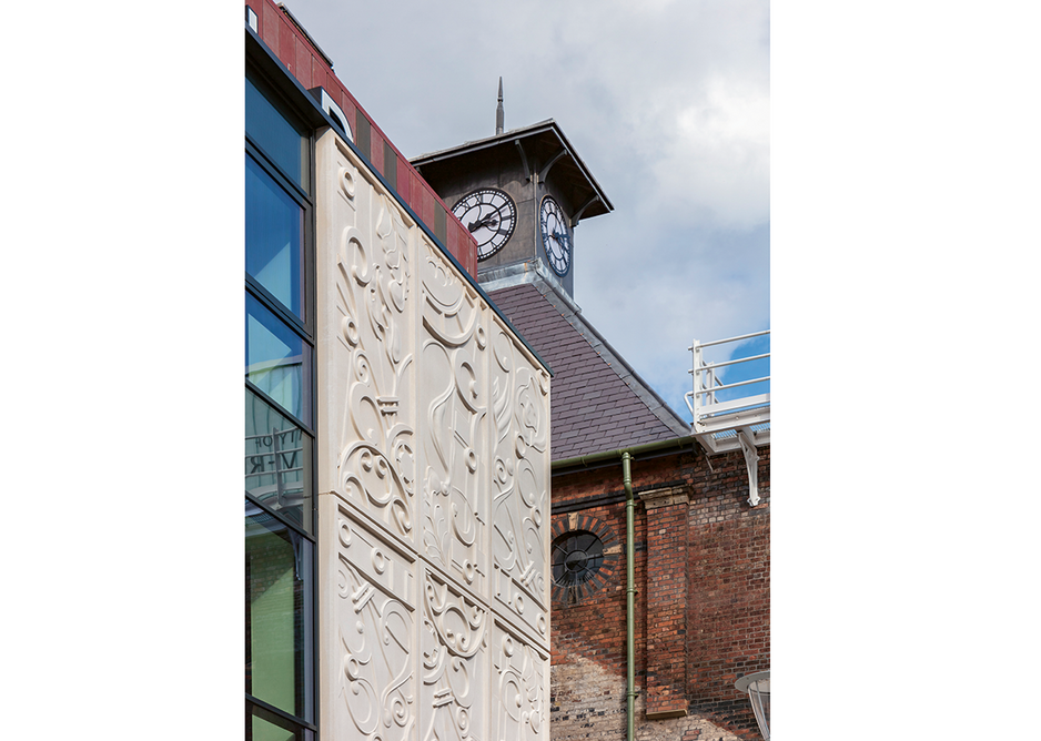 The clock tower has been restored to crown the new faculty building.