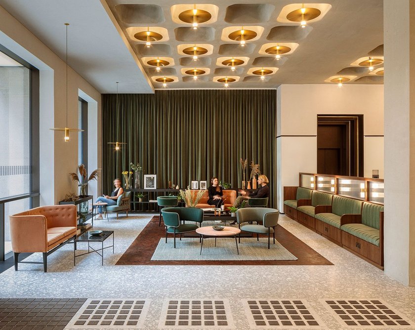 Pritchard Themis’s pendant lights create a warm glow in the coffered soffit of the reception at Buckley Gray Yeoman’s 77 Coleman Street in the City of London.