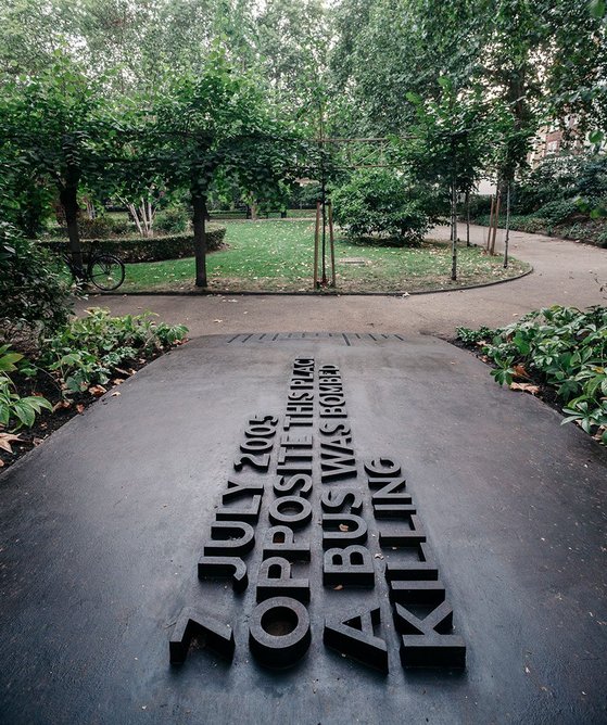The memorial forms a curved tablet linking the public pavement with the path in the park.