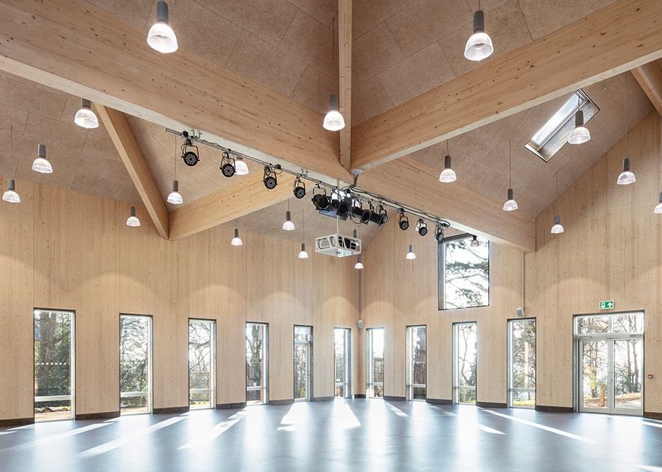 Four roofs break up the mass of the hall from outside, Internally the roof spaces criss-crossed by gluams give great character.