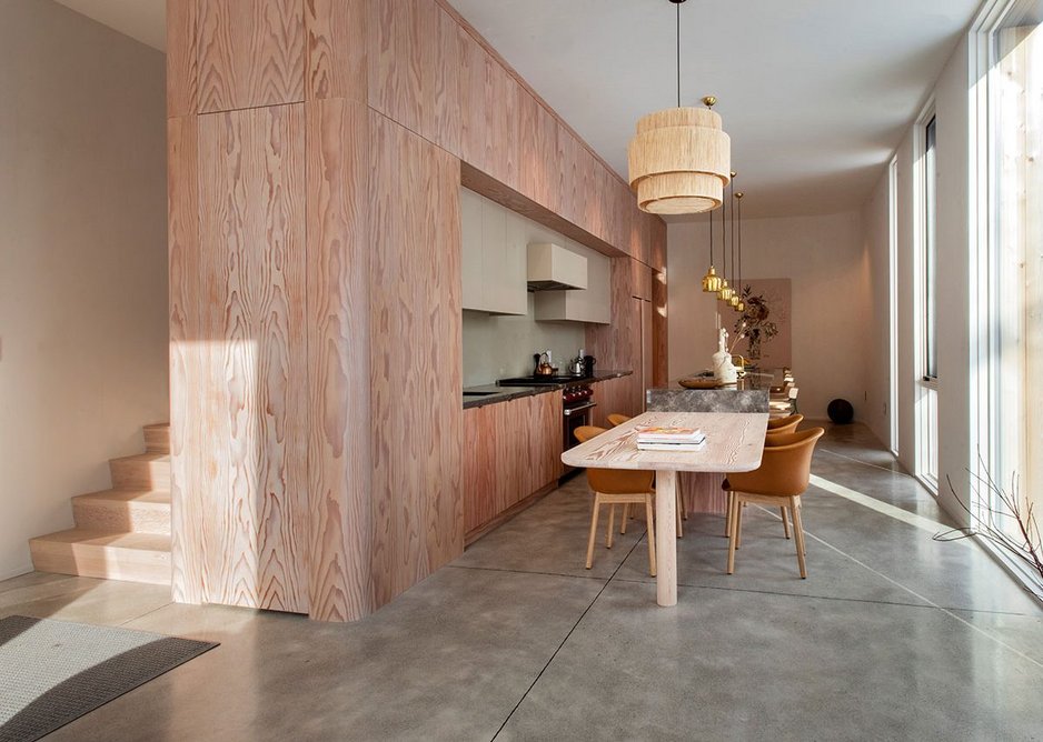 The kitchen with its wood cupboards and Brazilian stone island.