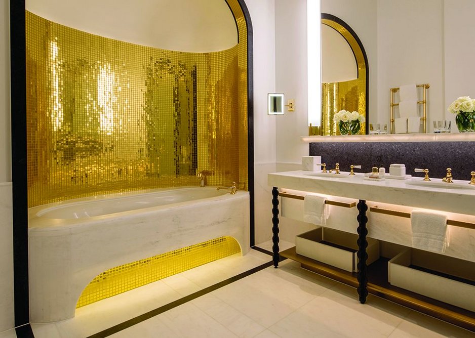 Gold mosaic on curved walls brings an indulgent bling factor to these luxurious spaces.